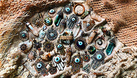 Spiritual protection jewelry flatlay with charms and crystals